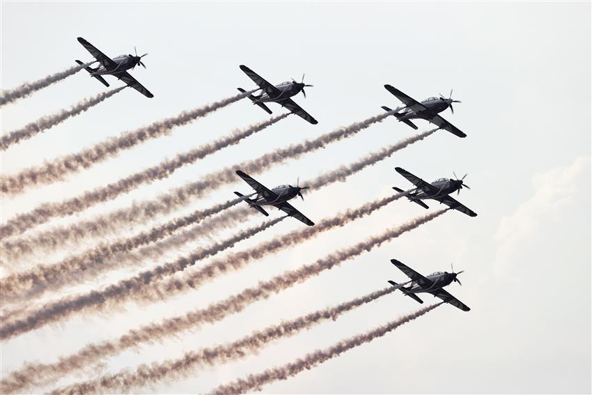 Airplane over race track